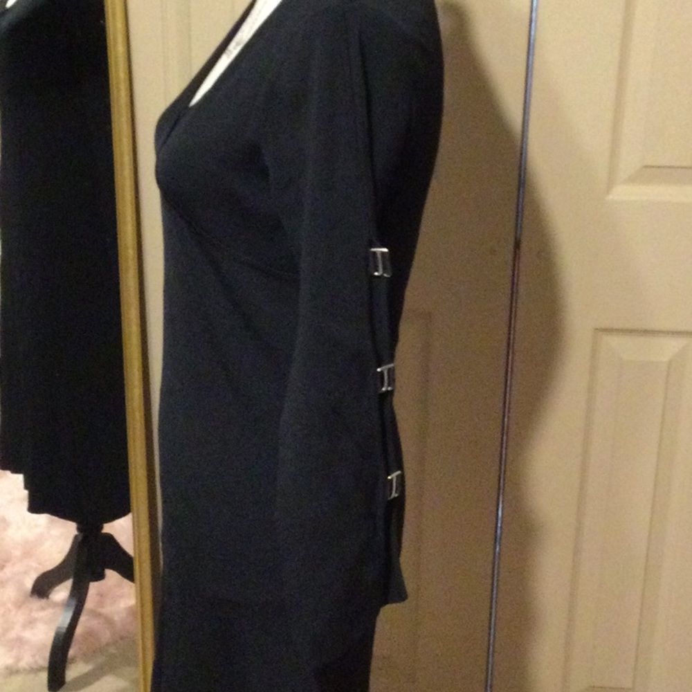 MTWT 9-5 black rayon stretch dress with peek a boo sleeves Size small. Runs big